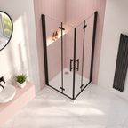 Vitrano matt black double bi fold square shower enclosure in a contemporary pink tiled bathroom