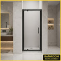 Vitrano matt black pivot shower door with 6mm easy clean glass in a modern Carrara marble bathroom