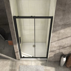 Elevated view of the Vitrano matt black sliding shower door and clear 8mm glass panels