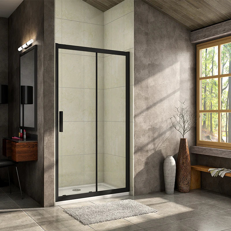 Vitrano matt black sliding shower door with clear 8mm glass fitted across a bathroom recess
