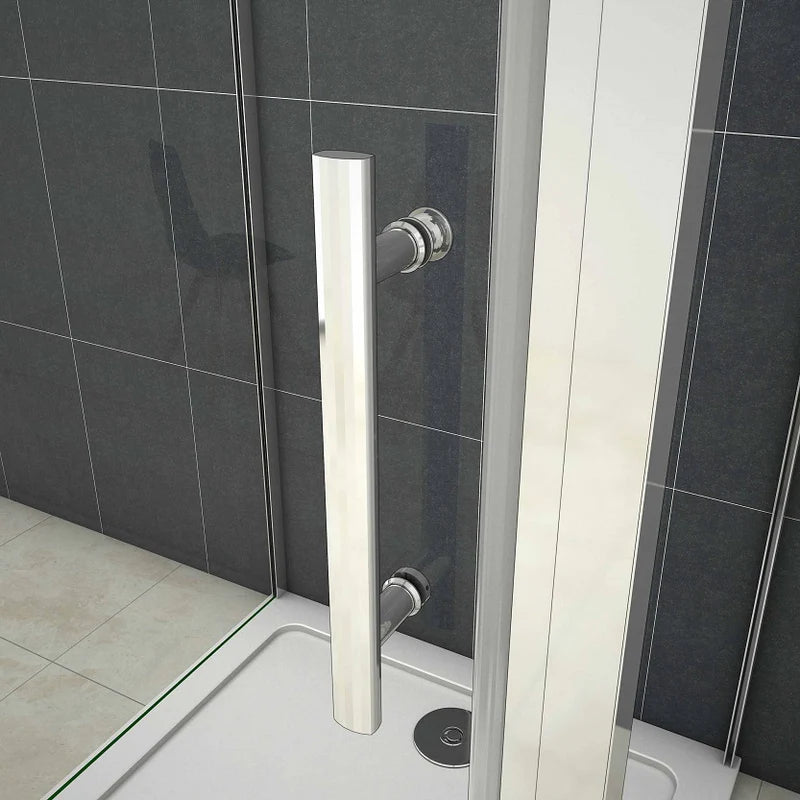 Close-up of chrome shower enclosure handle and sliding door mechanism