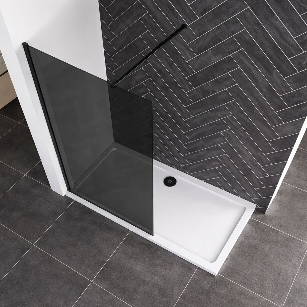 Black walk in shower screen with tray in contemporary grey tiled bathroom
