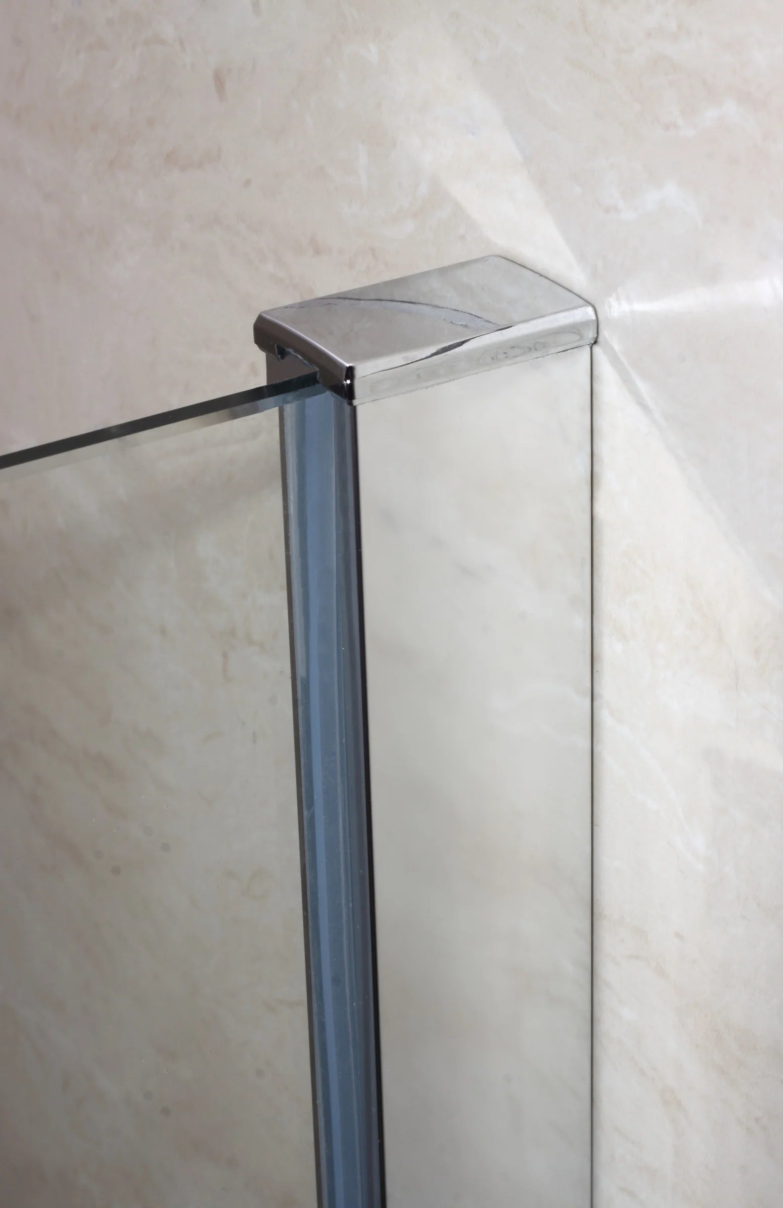 Close Up Of Chrome Wall Profile And Glass Panel On Walk In Shower Screen