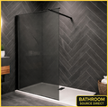 Black Framed Walk In Wet Room Shower Screen With Smoked Glass Installed In Modern Dark Herringbone Tiled Bathroom