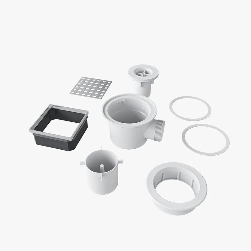 Set of plumbing components including a square drain, circular drain, and various connectors on a white background.